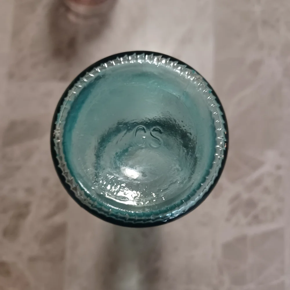 Set of Three Decorative Glass Bottles Clear Glass Light Pink And Teal Vases